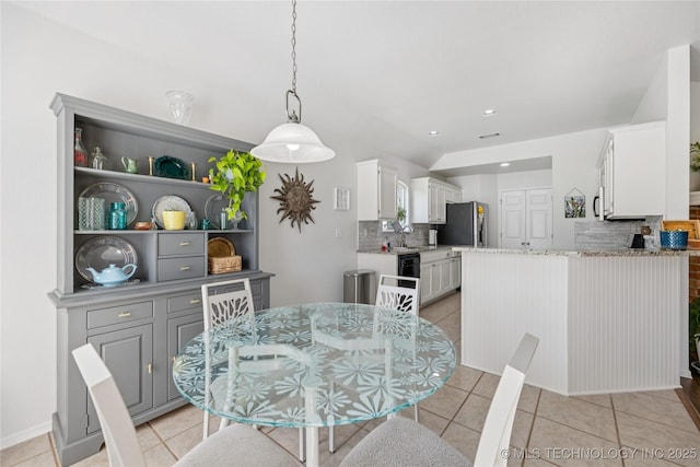 14907 E 88th St N, Owasso, OK 74055 - dining space with light tile patterned floors and recessed lighting