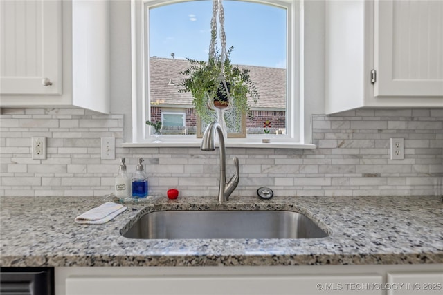 14907 E 88th St N, Owasso, OK 74055 - kitchen with white cabinets, backsplash, and light stone counters