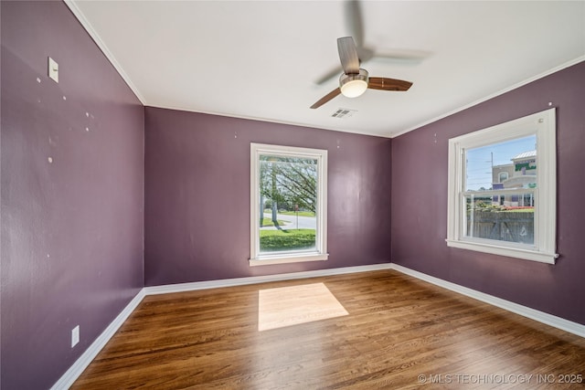 1448 S Darlington Ave, Tulsa, OK 74112 - spare room with wood finished floors, ceiling fan, and crown molding