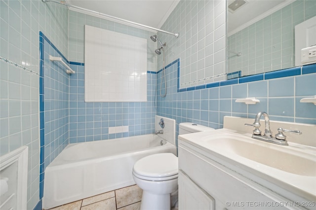 1448 S Darlington Ave, Tulsa, OK 74112 - bathroom with tile walls, ornamental molding, shower / bathtub combination, vanity, and tile patterned flooring