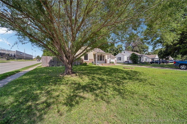 1448 S Darlington Ave, Tulsa, OK 74112 - view of front of home featuring a front yard and a residential view