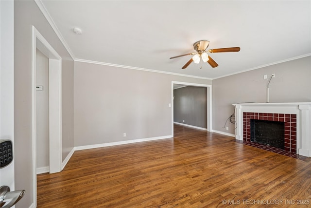 1448 S Darlington Ave, Tulsa, OK 74112 - unfurnished living room featuring a ceiling fan, wood finished floors, ornamental molding, and a tile fireplace