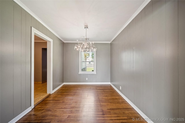 1448 S Darlington Ave, Tulsa, OK 74112 - unfurnished room with dark wood finished floors, a chandelier, and crown molding