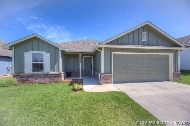 12005 E 108th Pl N, Owasso, OK 74055 - view of front of property featuring board and batten siding, a garage, concrete driveway, and a front yard