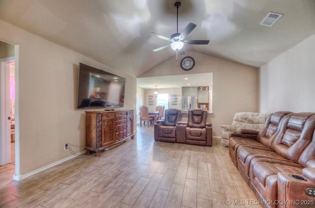 12005 E 108th Pl N, Owasso, OK 74055 - living room featuring light wood finished floors, a ceiling fan, and vaulted ceiling