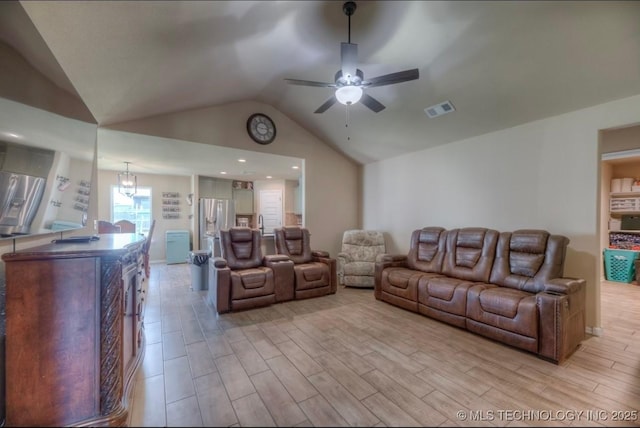 12005 E 108th Pl N, Owasso, OK 74055 - living room featuring lofted ceiling, light wood finished floors, and a ceiling fan
