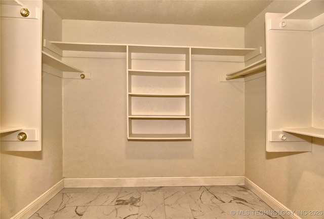 7020 E 89th St, Tulsa, OK 74133 - walk in closet featuring marble finish flooring
