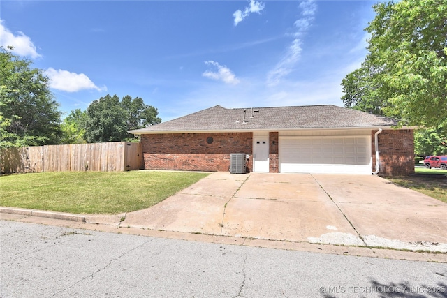 7020 E 89th St, Tulsa, OK 74133 - view of front of house featuring brick siding, driveway, a garage, and roof with shingles