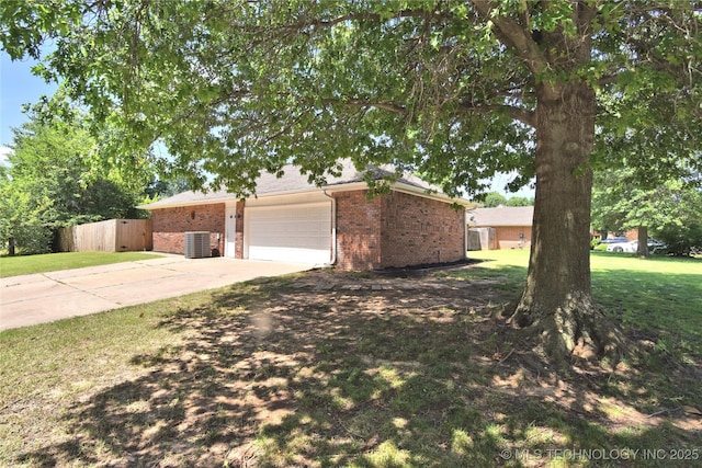 7020 E 89th St, Tulsa, OK 74133 - view of front of house with brick siding, driveway, and a garage