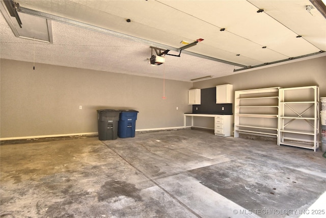 7020 E 89th St, Tulsa, OK 74133 - garage with a garage door opener and baseboards