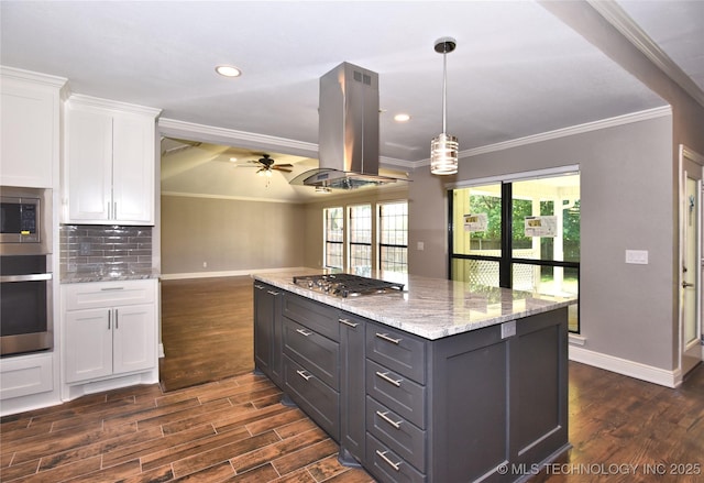 7020 E 89th St, Tulsa, OK 74133 - kitchen featuring stainless steel appliances, island exhaust hood, white cabinetry, ceiling fan, and dark wood-style floors