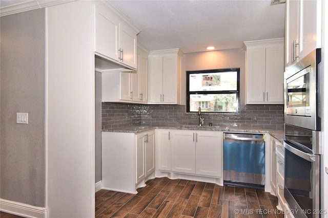 7020 E 89th St, Tulsa, OK 74133 - kitchen with appliances with stainless steel finishes, light stone countertops, recessed lighting, backsplash, and dark wood-type flooring