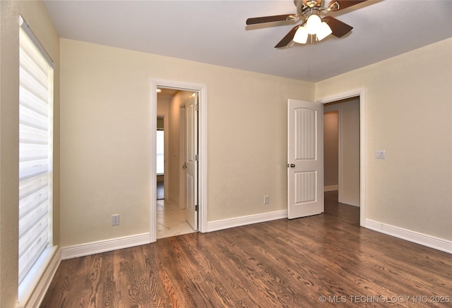 7020 E 89th St, Tulsa, OK 74133 - unfurnished bedroom with dark wood-type flooring and connected bathroom