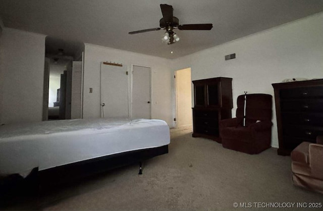 8348 E 7th St S, Tulsa, OK 74112 - carpeted bedroom featuring a ceiling fan