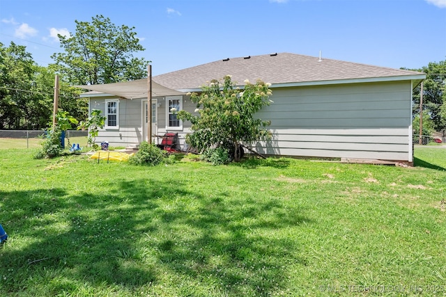 802 NE 9th St, Wagoner, OK 74467 - back of property with roof with shingles