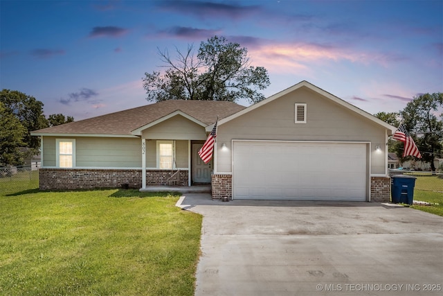 802 NE 9th St, Wagoner, OK 74467 - ranch-style home featuring brick siding, covered porch, driveway, and a garage