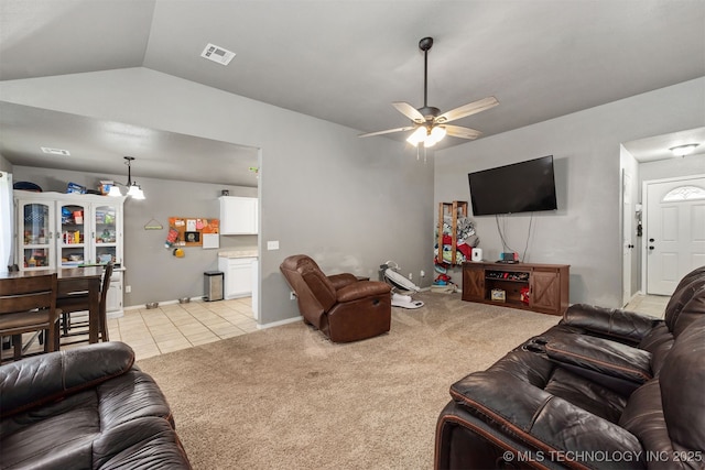 802 NE 9th St, Wagoner, OK 74467 - living area featuring ceiling fan, lofted ceiling, light colored carpet, and light tile patterned floors