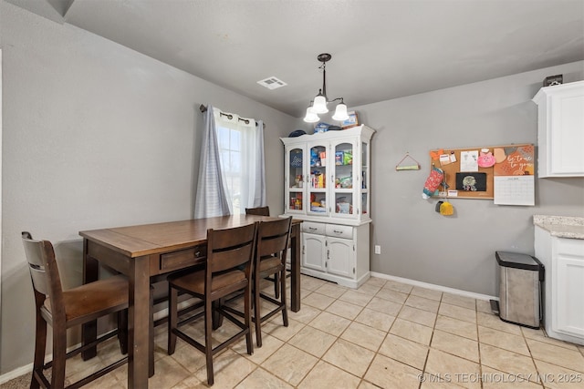 802 NE 9th St, Wagoner, OK 74467 - dining area with light tile patterned floors and baseboards