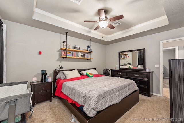 802 NE 9th St, Wagoner, OK 74467 - bedroom featuring a raised ceiling, light colored carpet, crown molding, and ceiling fan