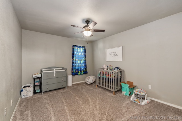 802 NE 9th St, Wagoner, OK 74467 - carpeted bedroom featuring a nursery area and a ceiling fan