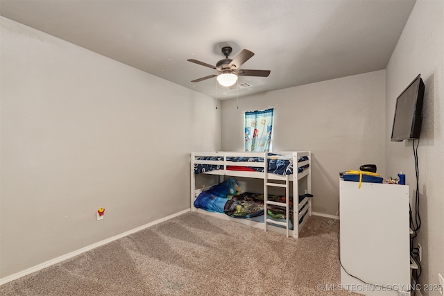 802 NE 9th St, Wagoner, OK 74467 - carpeted bedroom with baseboards and ceiling fan