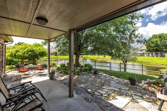 13804 E 90th St, Owasso, OK 74055 - fenced backyard featuring a patio and a water view