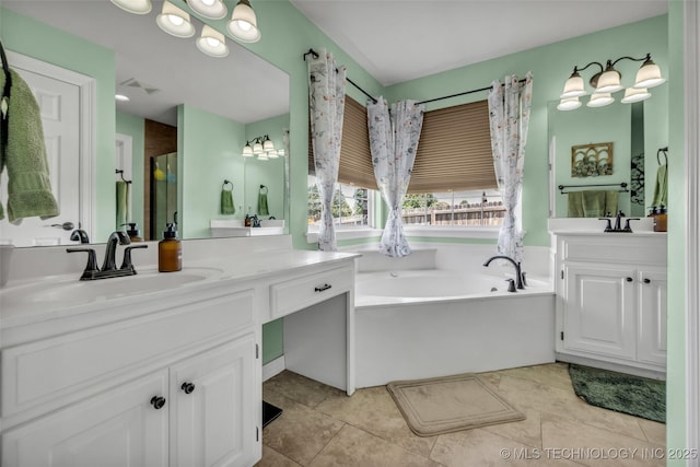 13804 E 90th St, Owasso, OK 74055 - bathroom featuring a bath, two vanities, and tile patterned floors