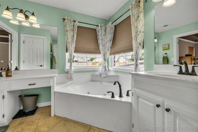 13804 E 90th St, Owasso, OK 74055 - bathroom featuring vanity, a whirlpool tub, and tile patterned floors