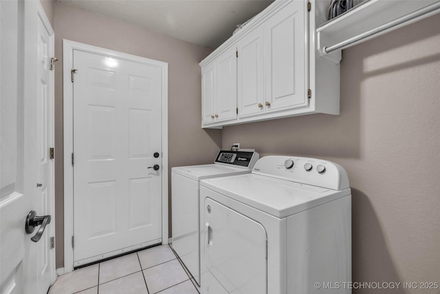 13804 E 90th St, Owasso, OK 74055 - washroom featuring washing machine and dryer, cabinet space, and light tile patterned flooring