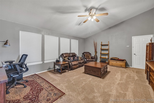 13804 E 90th St, Owasso, OK 74055 - carpeted living room with lofted ceiling, a ceiling fan, and a desk