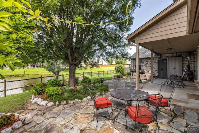 13804 E 90th St, Owasso, OK 74055 - fenced backyard featuring a patio area and outdoor dining area