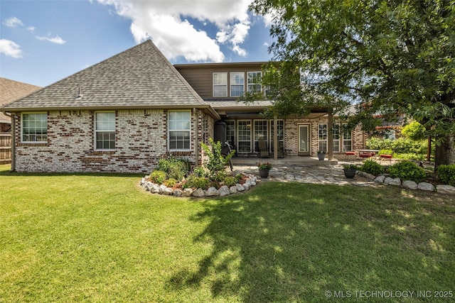 13804 E 90th St, Owasso, OK 74055 - back of property with a patio area, brick siding, roof with shingles, and a yard