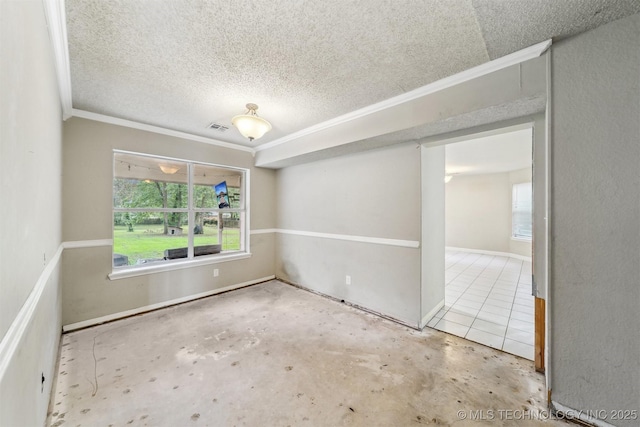 8973 N Crestwood Dr, Sperry, OK 74073 - spare room featuring crown molding and a textured ceiling