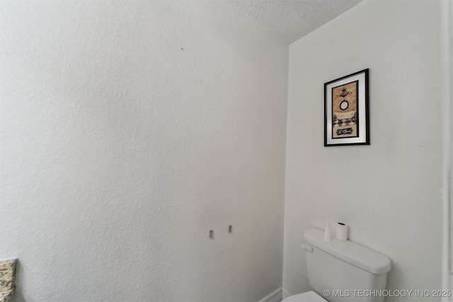 8973 N Crestwood Dr, Sperry, OK 74073 - bathroom featuring toilet and a textured ceiling