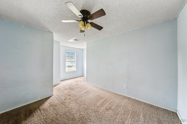 8973 N Crestwood Dr, Sperry, OK 74073 - carpeted empty room featuring ceiling fan and a textured ceiling