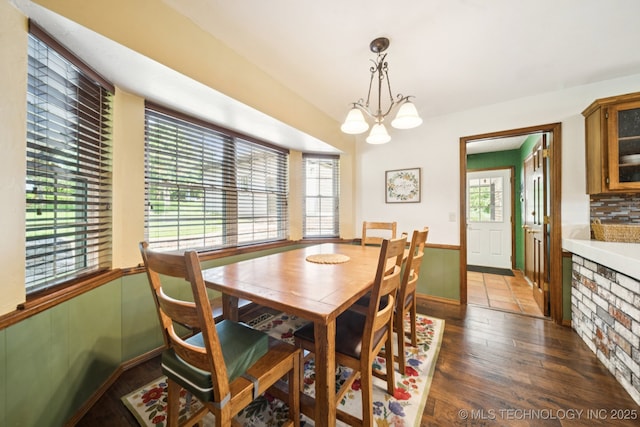 11783 S 252nd E Ave E, Broken Arrow, OK 74014 - dining space featuring wainscoting, dark wood finished floors, and a chandelier