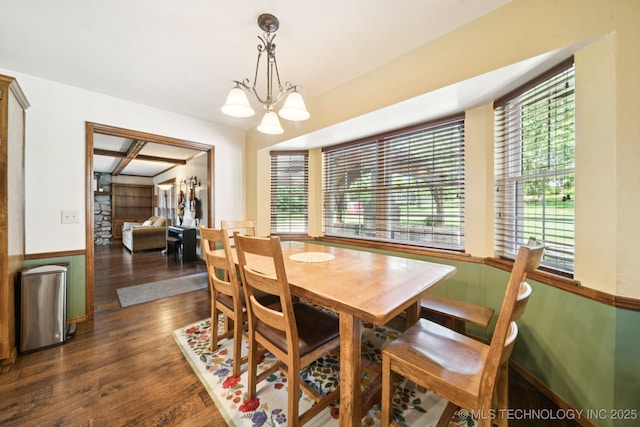 11783 S 252nd E Ave E, Broken Arrow, OK 74014 - dining area with dark wood-style floors, a chandelier, and a wainscoted wall