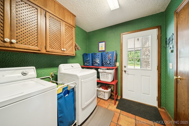 11783 S 252nd E Ave E, Broken Arrow, OK 74014 - laundry area featuring washer and clothes dryer, cabinet space, a textured ceiling, and light tile patterned floors