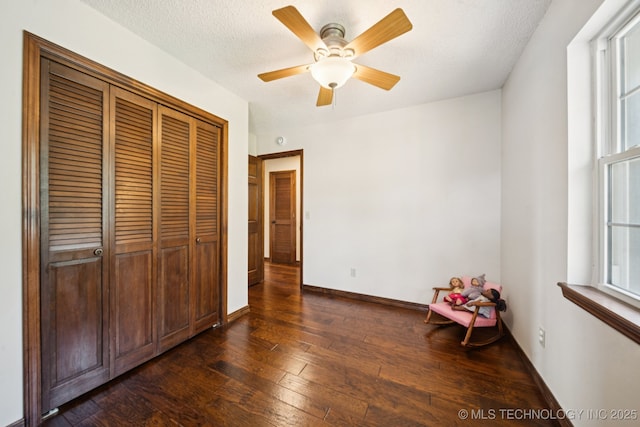 11783 S 252nd E Ave E, Broken Arrow, OK 74014 - unfurnished bedroom featuring dark wood-style flooring, a closet, a ceiling fan, and a textured ceiling