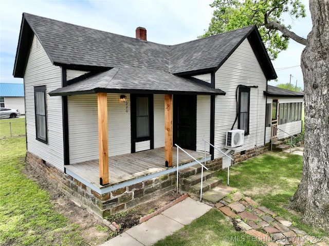 220 Belt Ave, Eufaula, OK 74432 - view of front of home with a shingled roof, a chimney, crawl space, a front lawn, and a porch