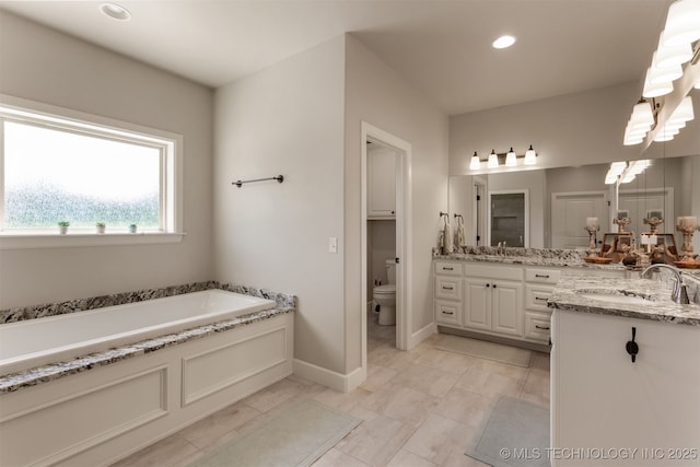 22322 E 121st St S, Broken Arrow, OK 74014 - full bath with double vanity, a garden tub, and recessed lighting