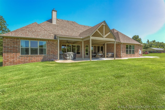 22322 E 121st St S, Broken Arrow, OK 74014 - rear view of property with brick siding, roof with shingles, and a patio