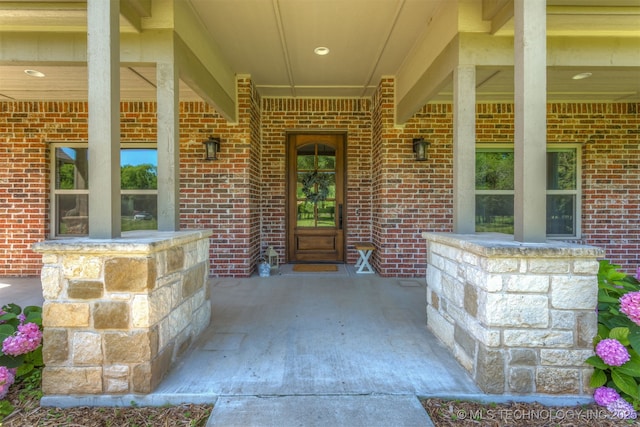 22322 E 121st St S, Broken Arrow, OK 74014 - doorway to property featuring brick siding