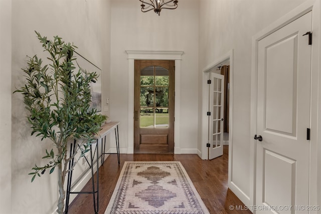 22322 E 121st St S, Broken Arrow, OK 74014 - foyer entrance with dark wood-type flooring and a chandelier