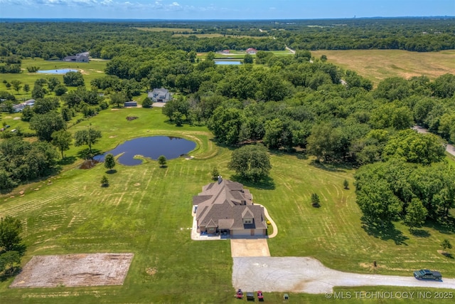 22322 E 121st St S, Broken Arrow, OK 74014 - drone / aerial view of a nearby body of water and a heavily wooded area