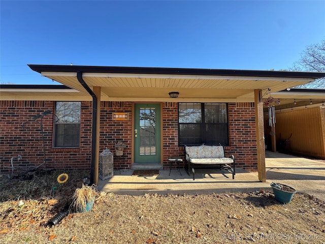 769 Terrace Dr, Prue, OK 74060 - property entrance featuring brick siding, a carport, and concrete driveway