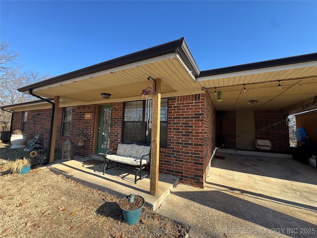 769 Terrace Dr, Prue, OK 74060 - view of patio featuring a carport and concrete driveway