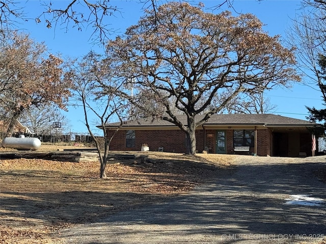 769 Terrace Dr, Prue, OK 74060 - view of front of house with brick siding and gravel driveway