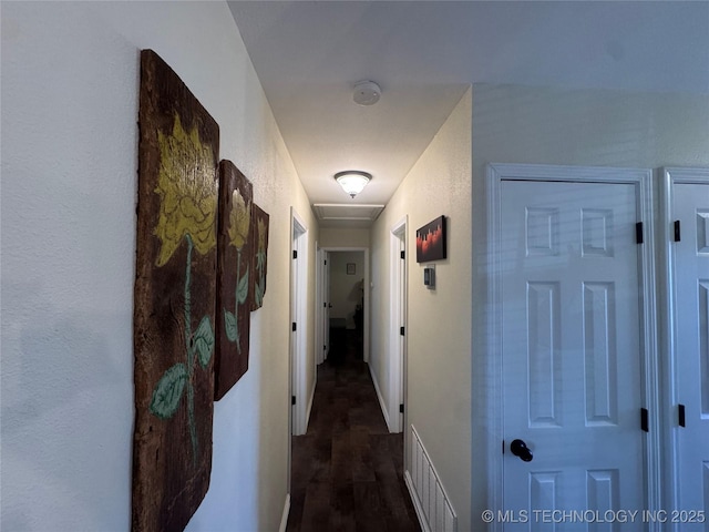 769 Terrace Dr, Prue, OK 74060 - hallway featuring dark wood-style flooring and baseboards