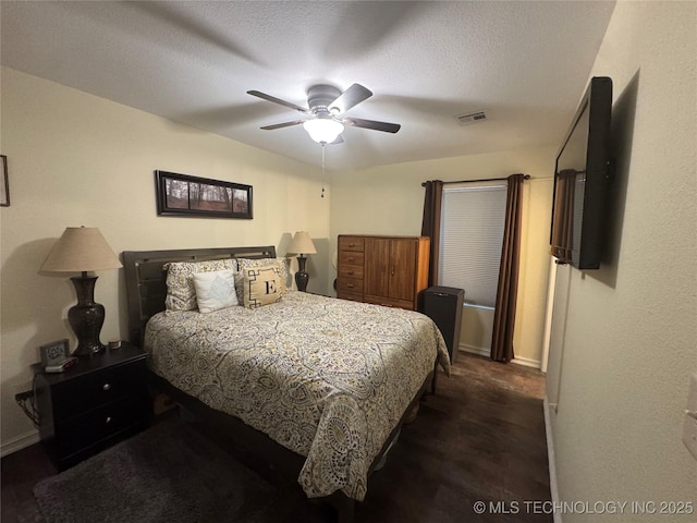 769 Terrace Dr, Prue, OK 74060 - bedroom with a ceiling fan, a textured ceiling, and dark wood-style floors